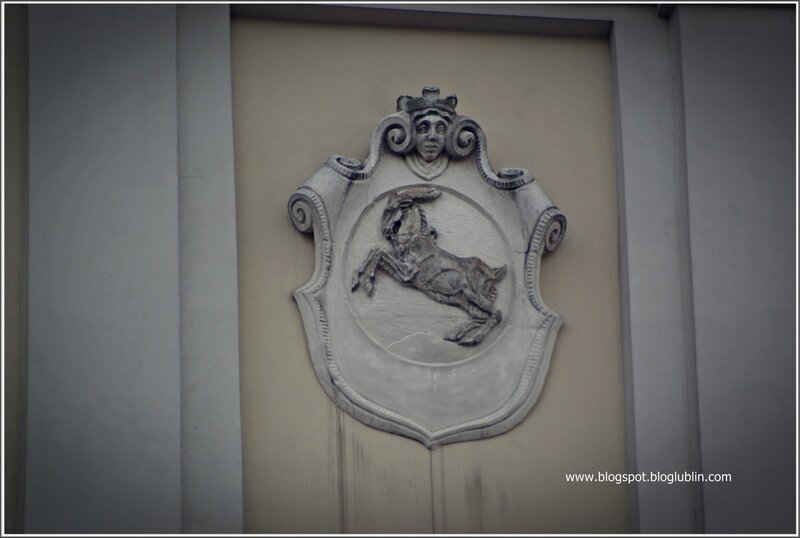 stone coat of arms on wall
