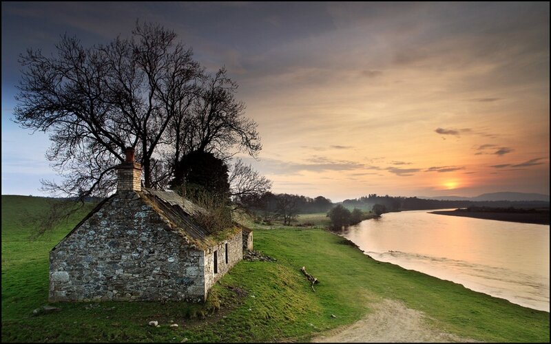 Stone Cottage by River — Green, Serene, Sunset