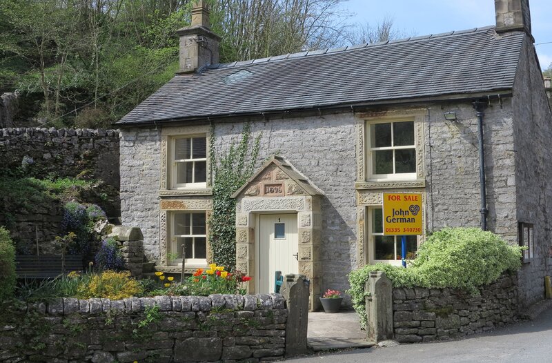 Stone Cottage with for Sale Sign