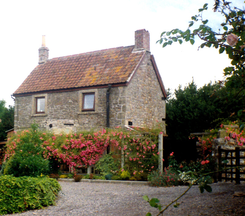 stone cottage with rose garden