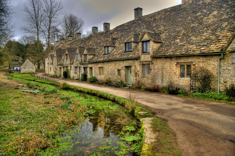 Stone cottages along a stream