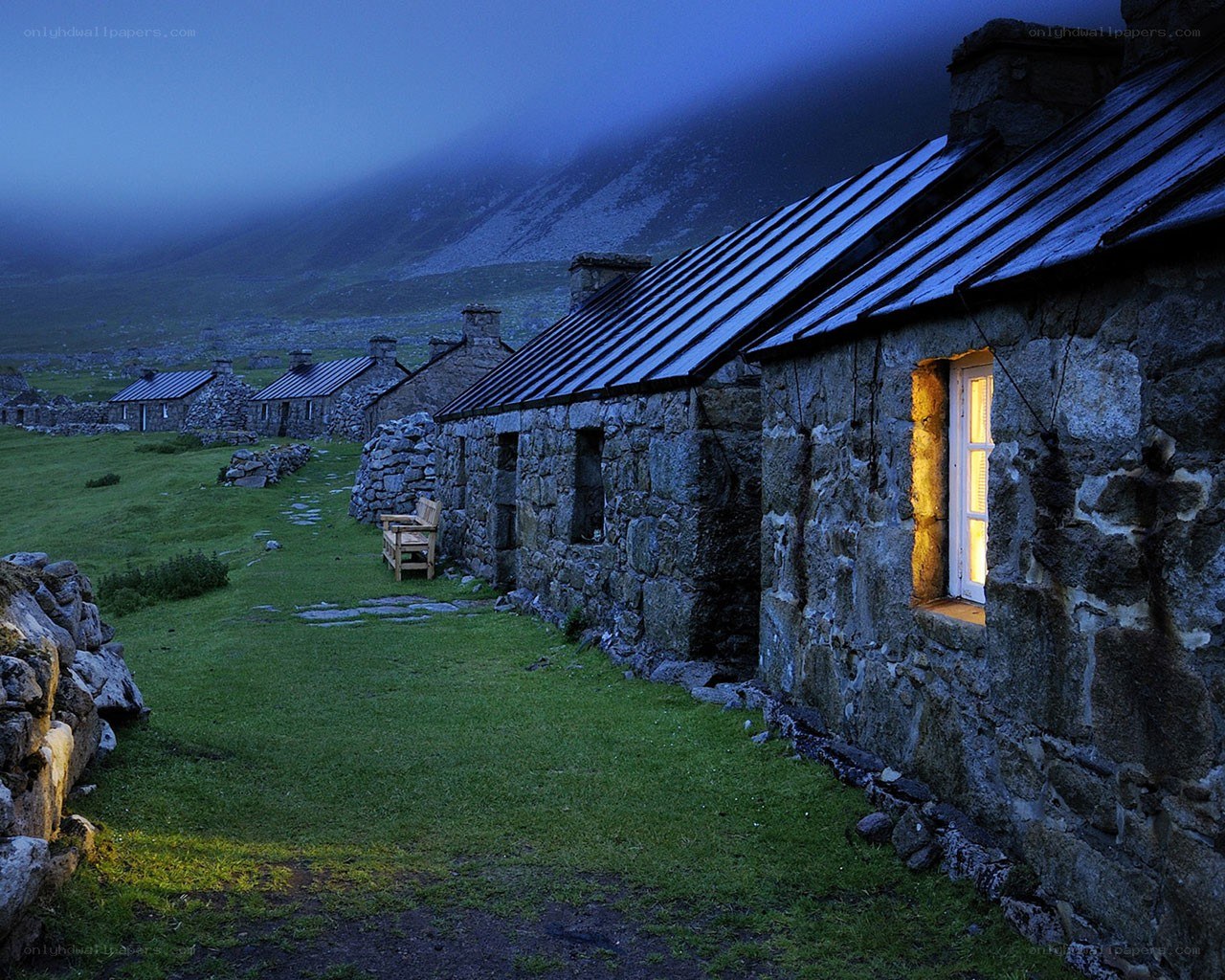 Stone cottages at dusk