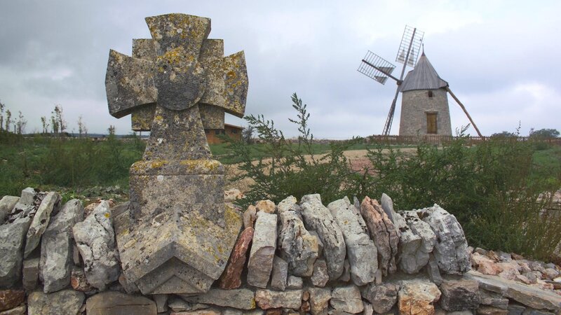 Stone cross and windmill