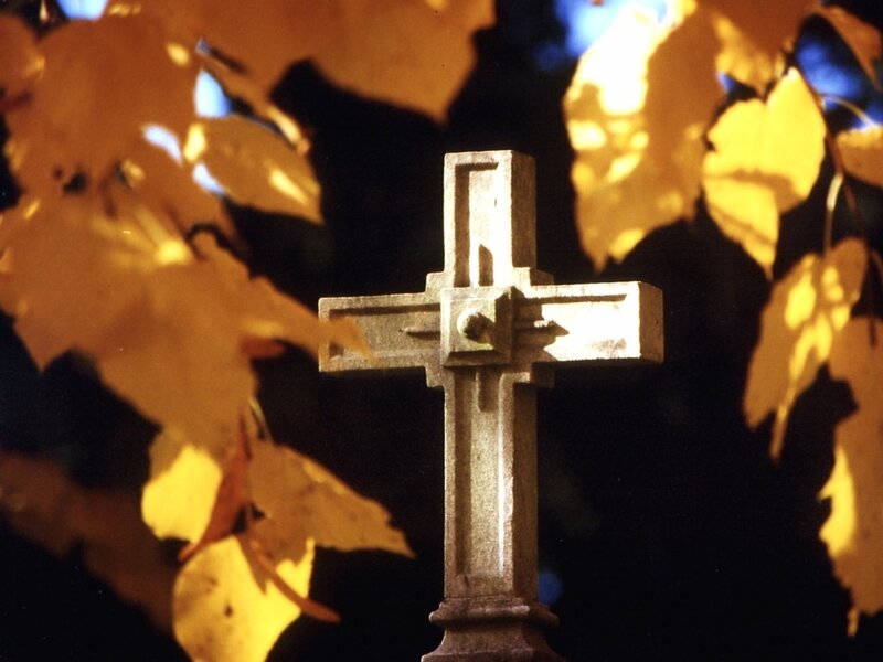 Stone Cross in Autumn Leaves