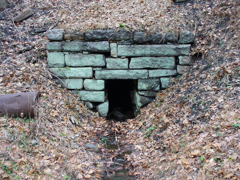 Stone culvert under a path