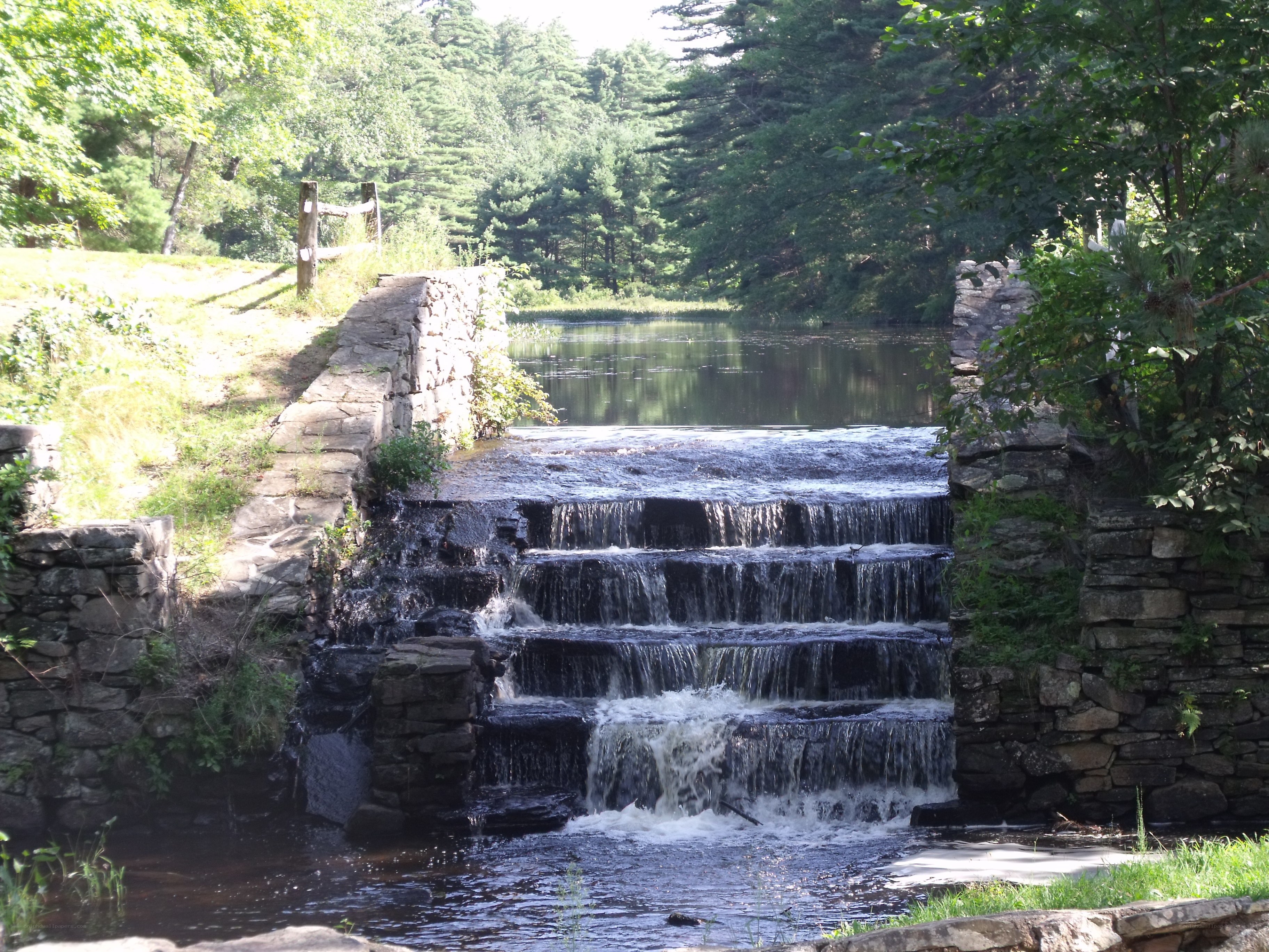 Stone dam with small waterfall