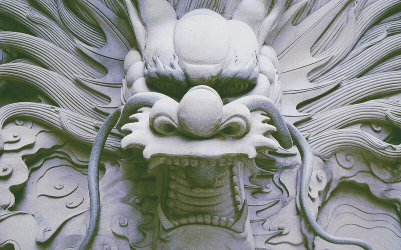 Stone Dragon Carving — Gray, Dramatic, Photograph, Clouds