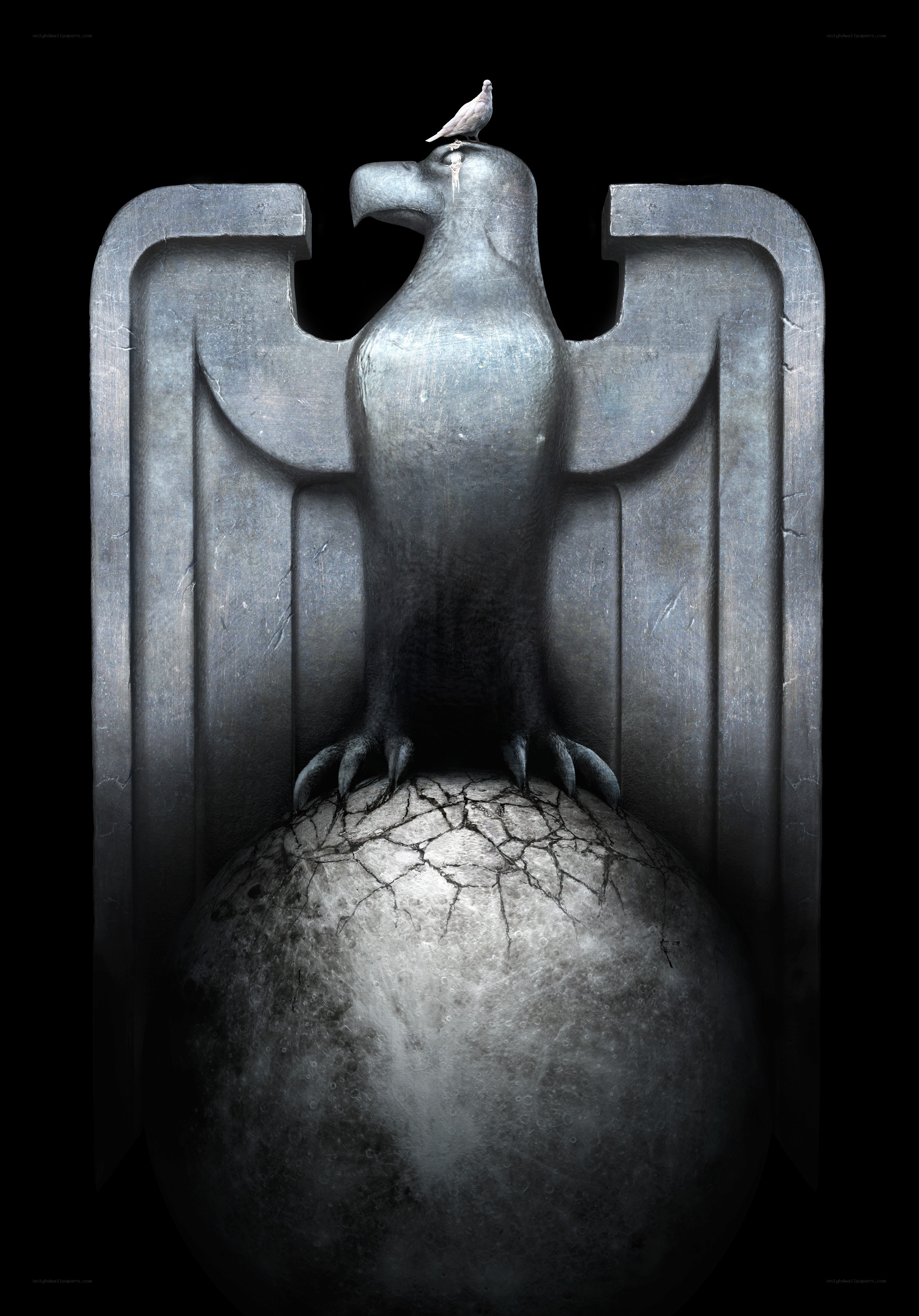 Stone eagle with dove on cracked sphere