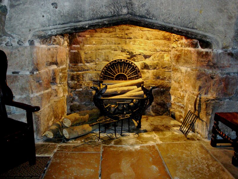Stone fireplace with logs