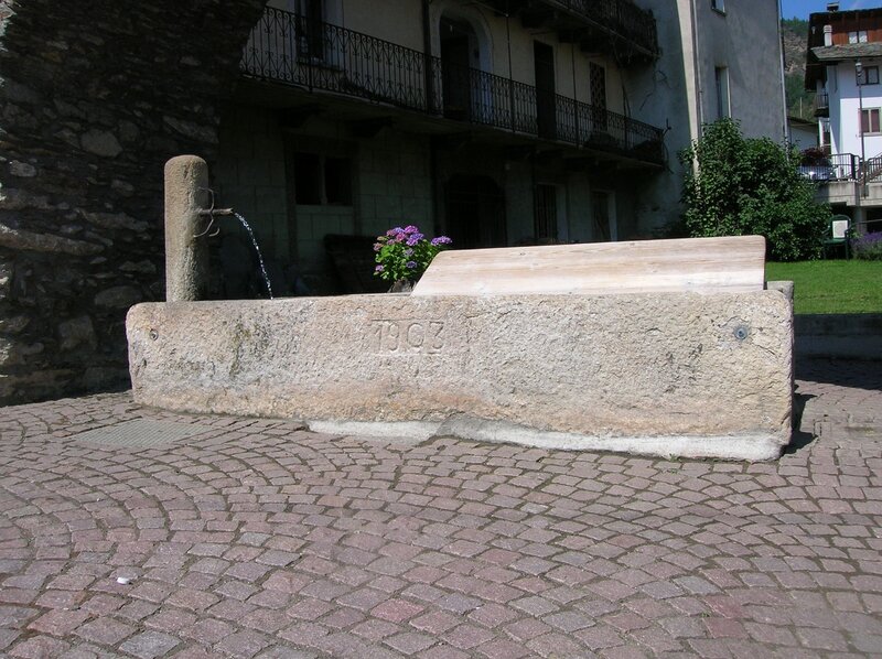 stone fountain in village square