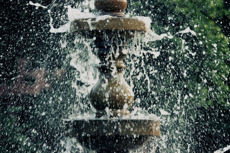 Stone Fountain Splashing Water
