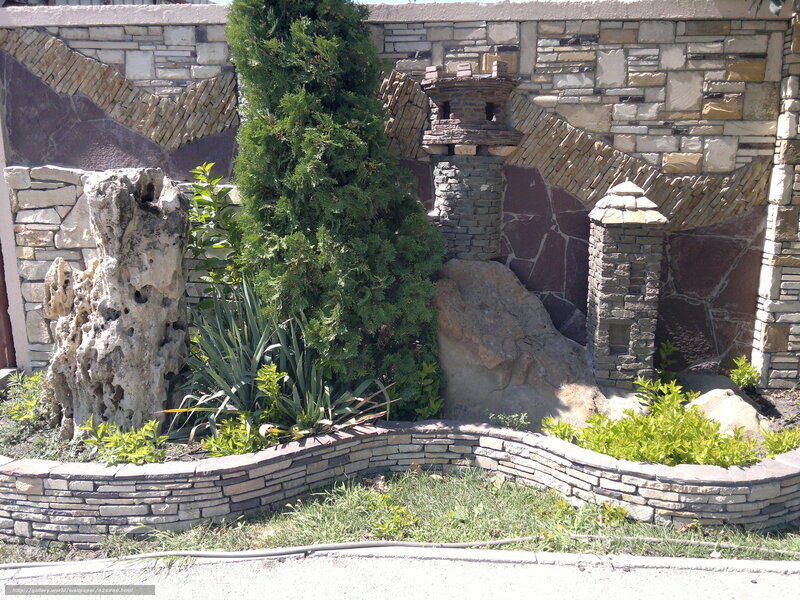 Stone garden wall with greenery