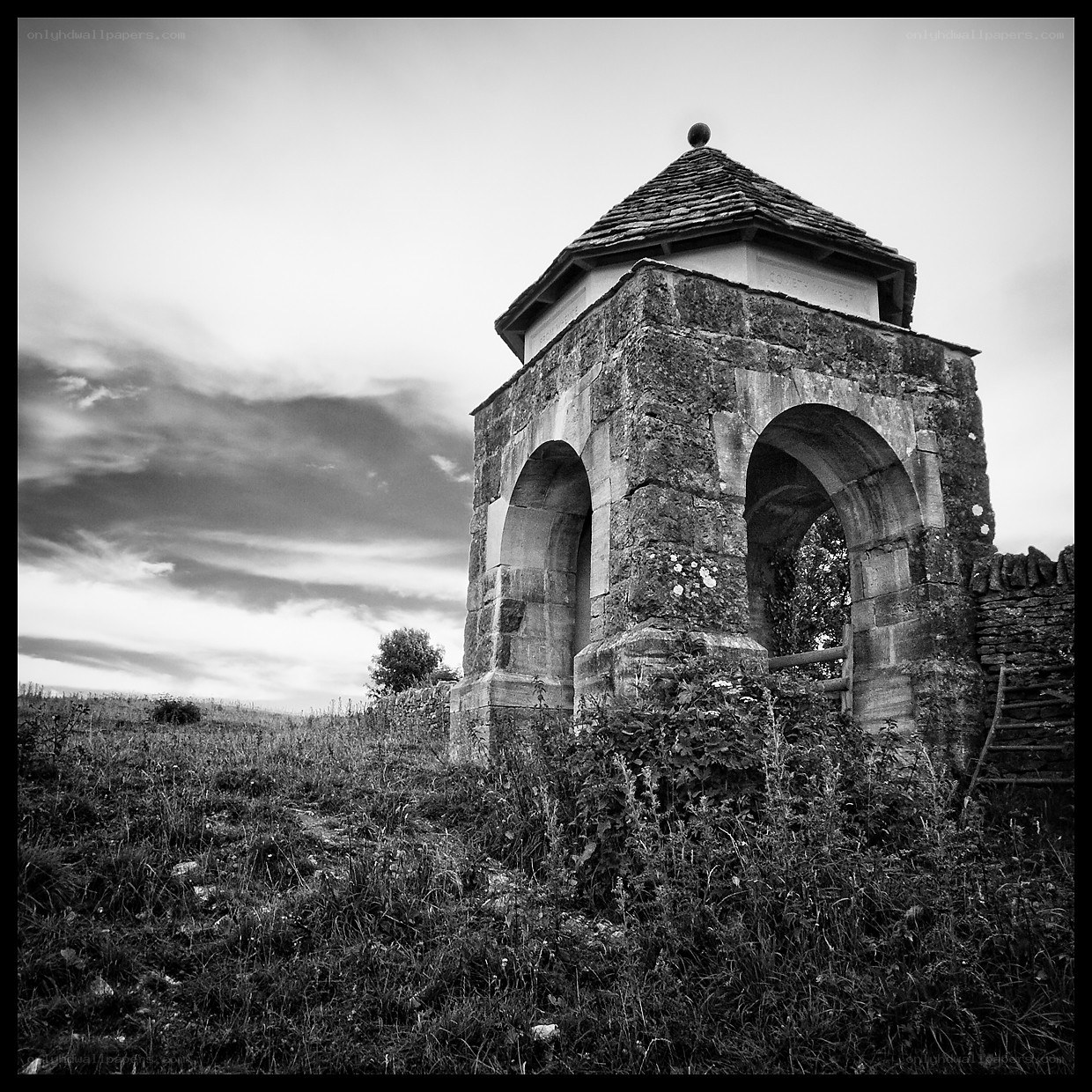 Stone gazebo in a field