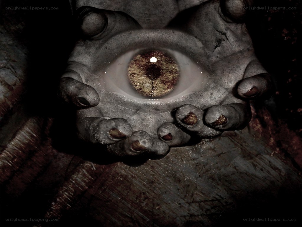 stone hand holding an eye