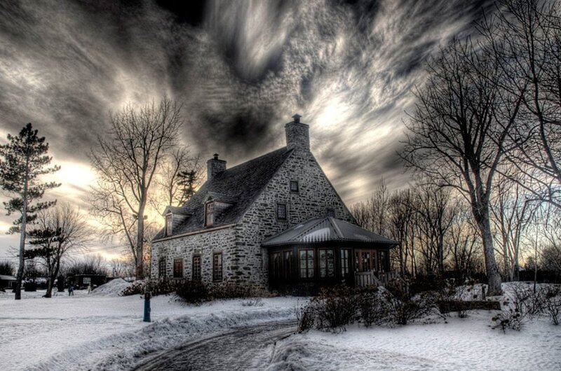 Stone house in snowy landscape