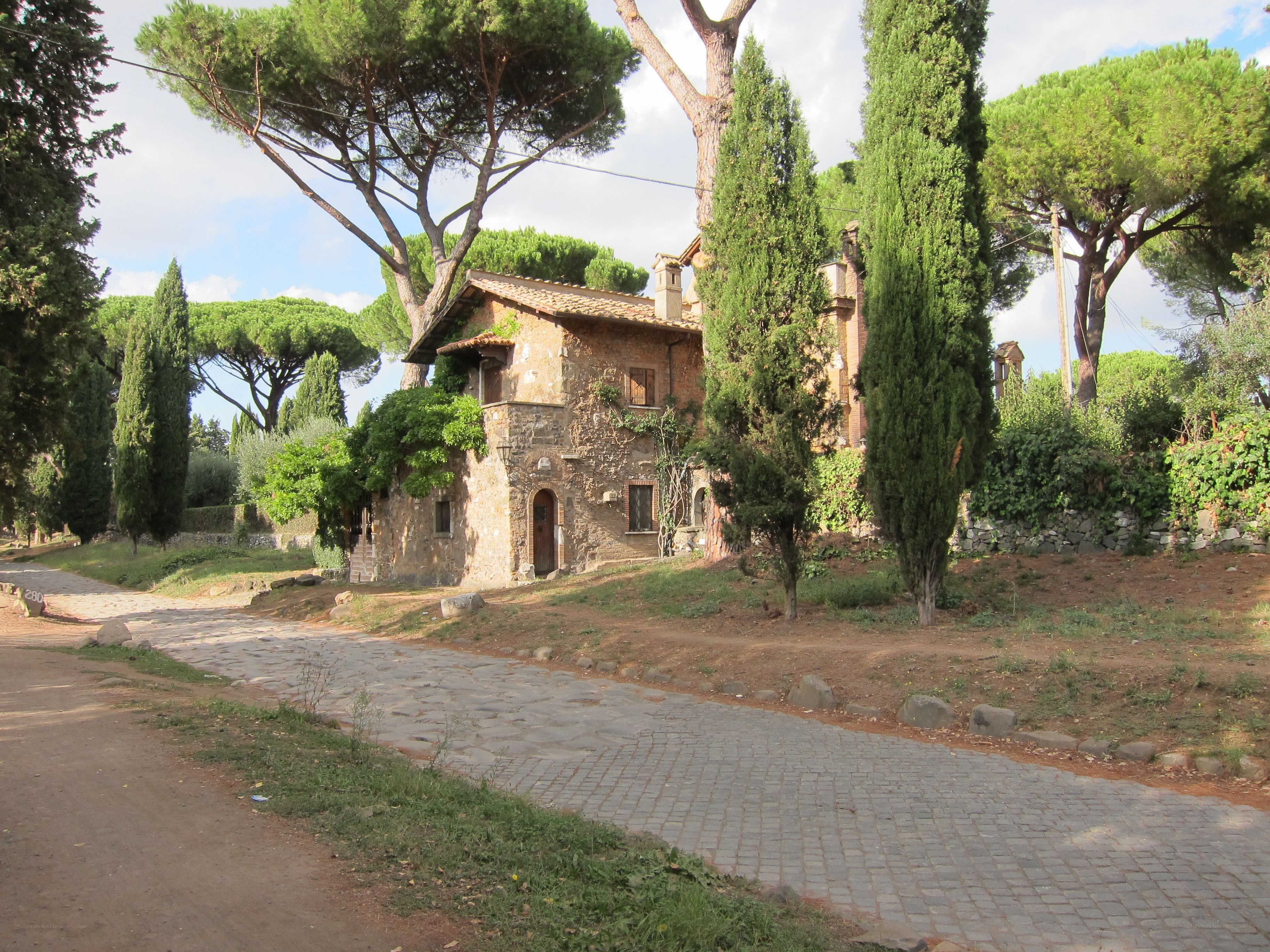 Stone house on a cobblestone road