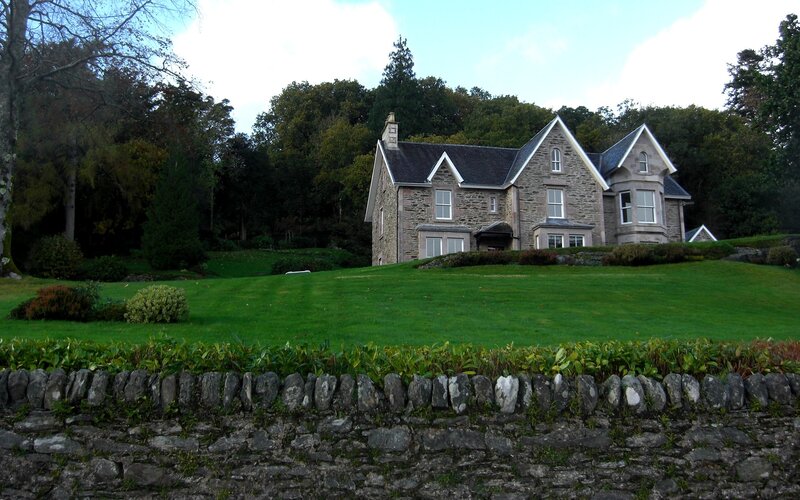 Stone house on a grassy hill
