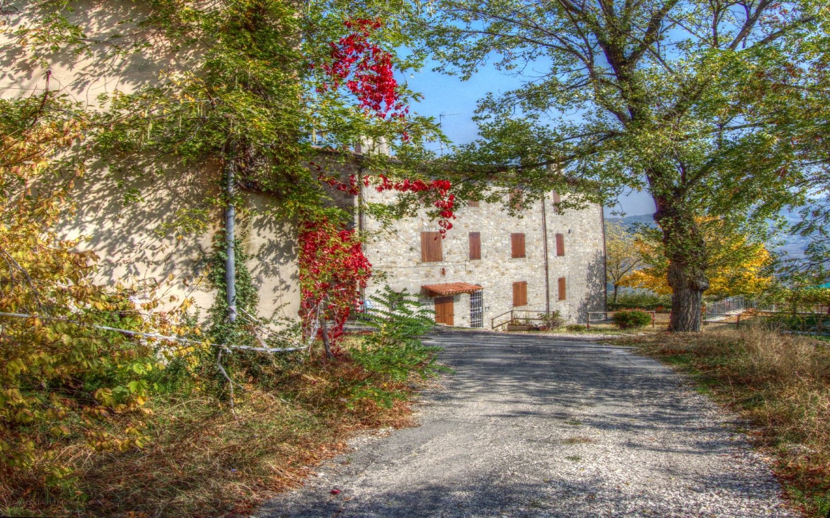 Stone house with autumn foliage