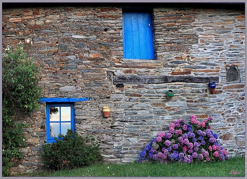 Stone house with blue windows