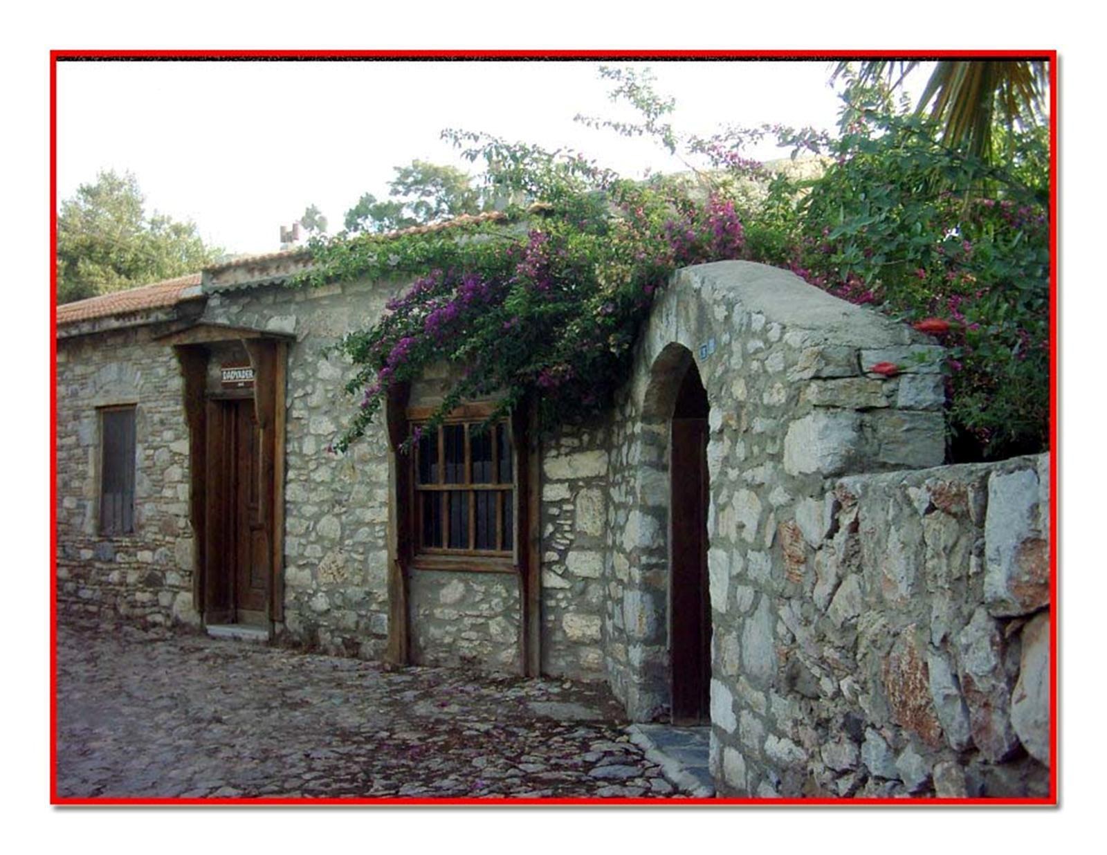 stone house with bougainvillea