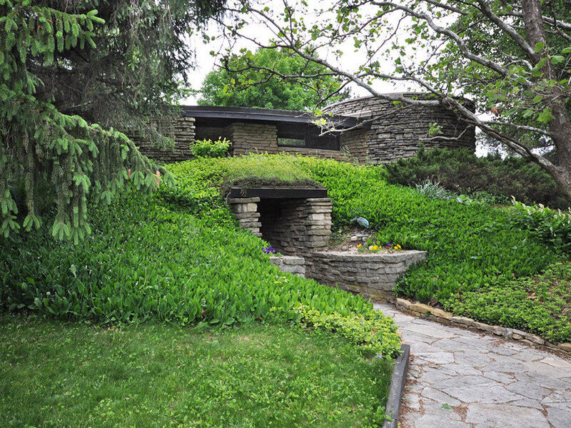Stone house with green roof