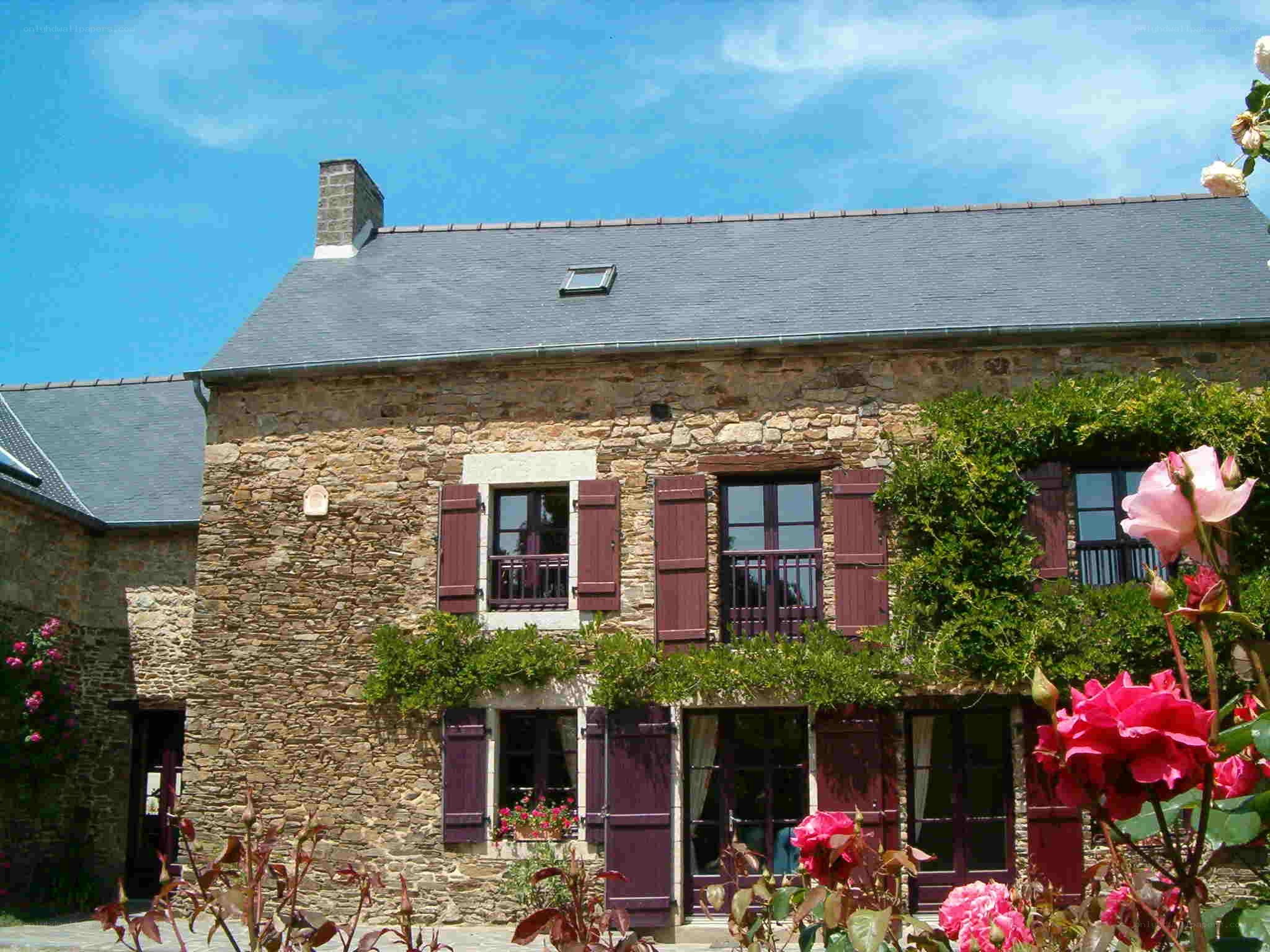 Stone house with rose garden