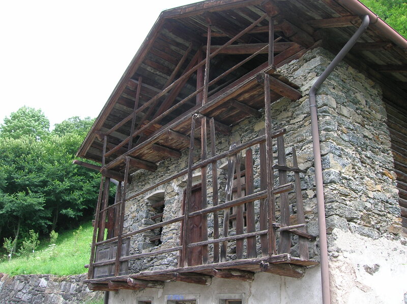 Stone House with Wooden Balcony