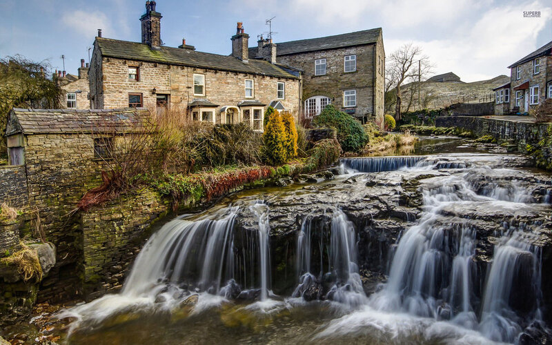 Stone Houses by Waterfall