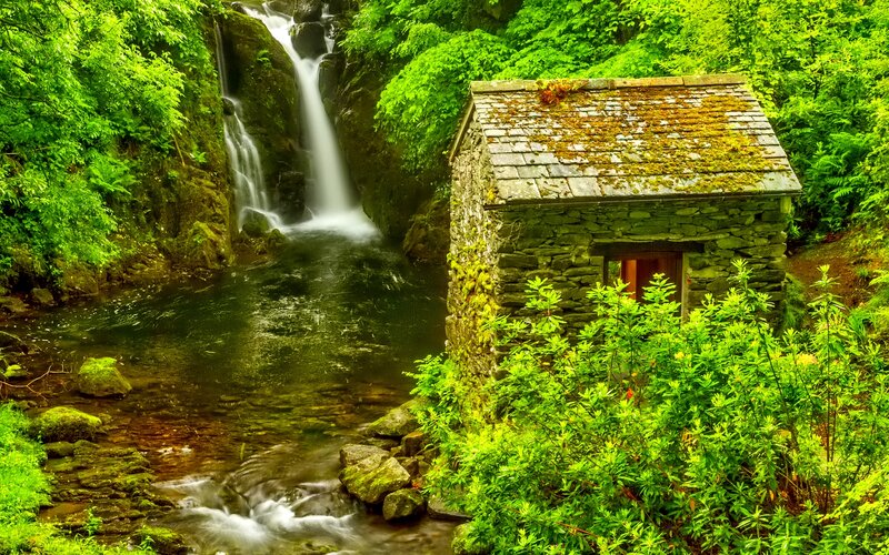 Stone Hut by Waterfall
