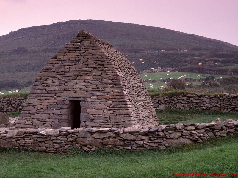 Stone hut in a green landscape