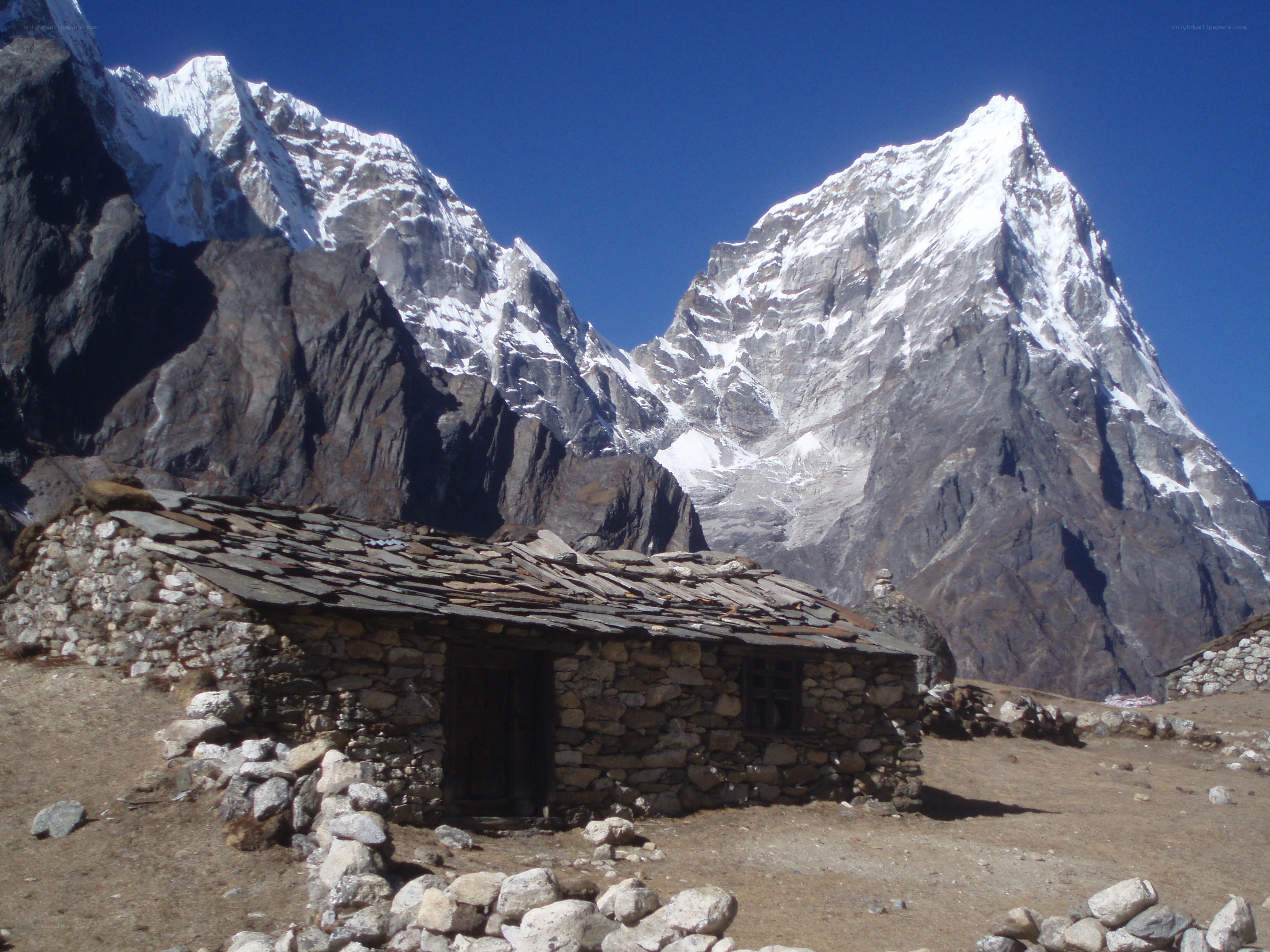 Stone hut in mountain valley