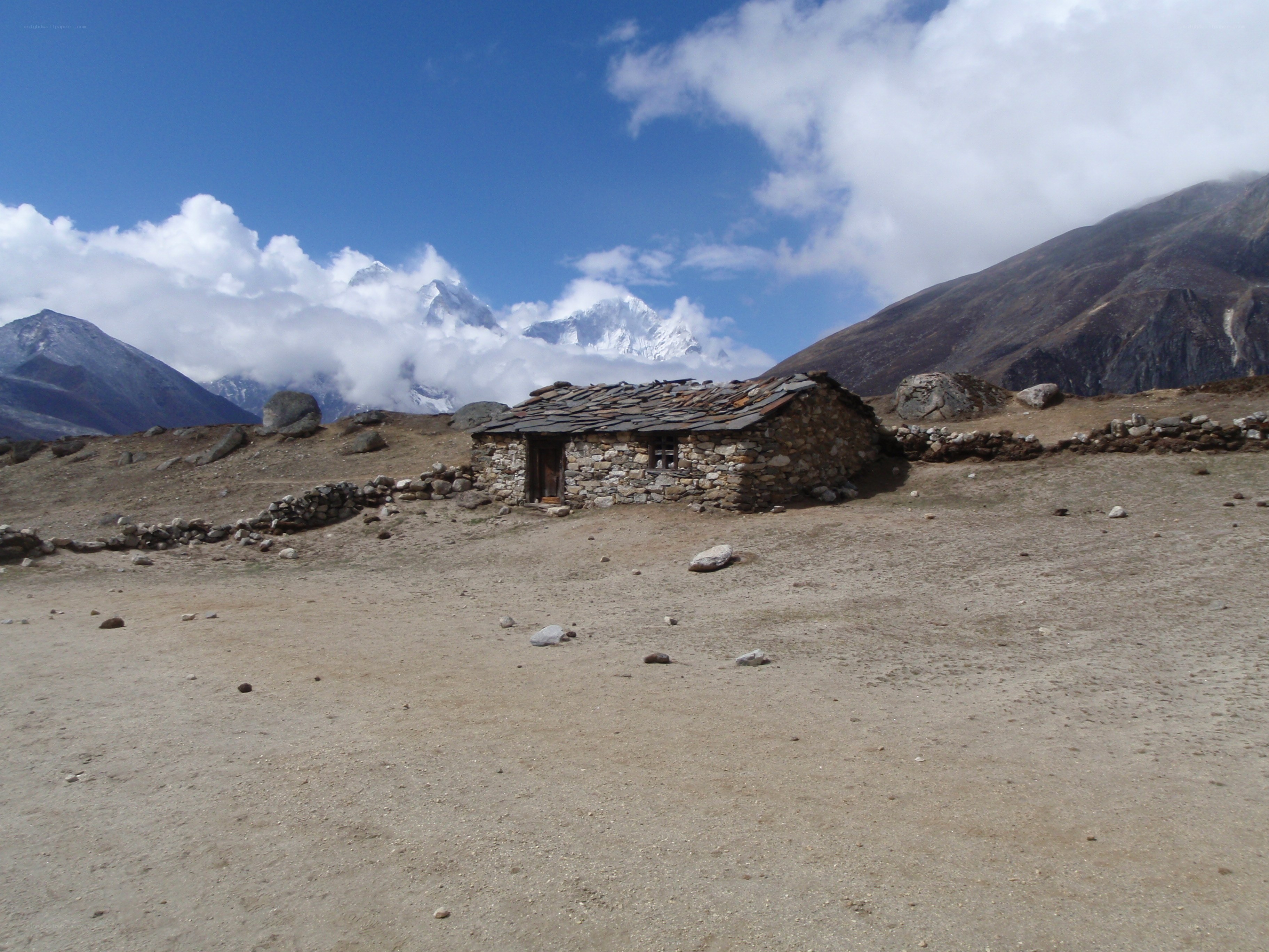 Stone hut in mountain valley