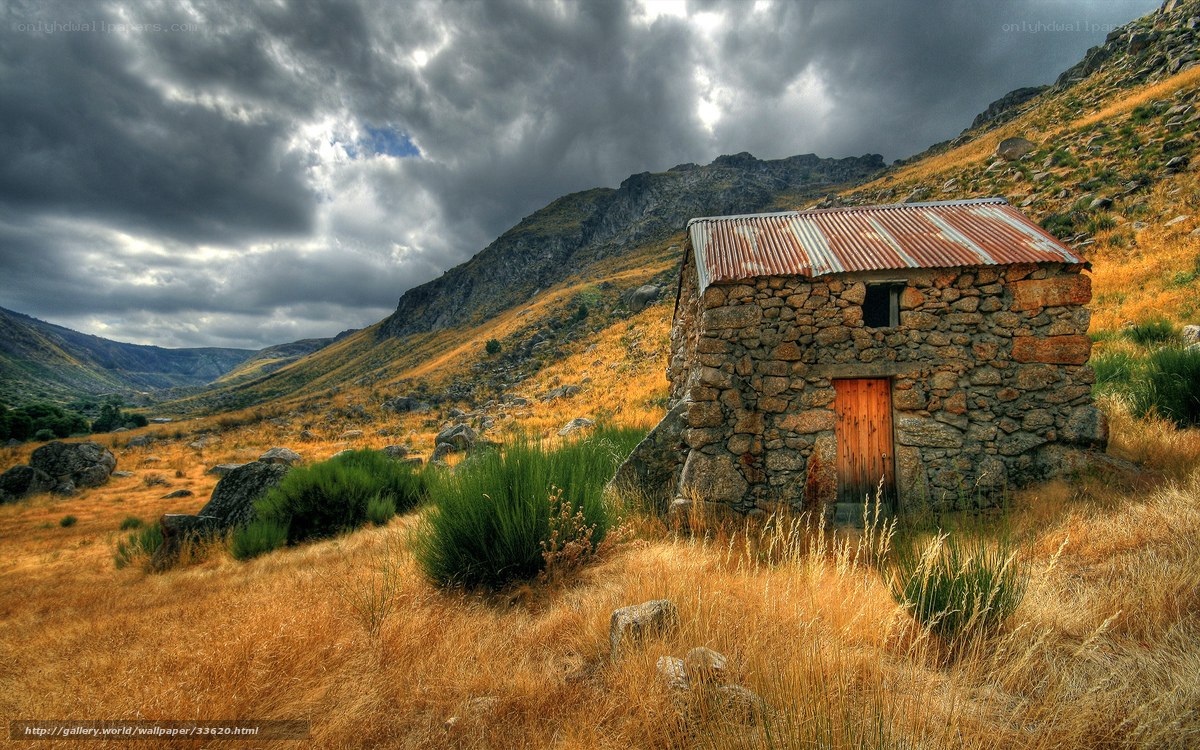 Stone hut in mountain valley