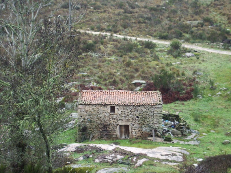 Stone hut in rural landscape