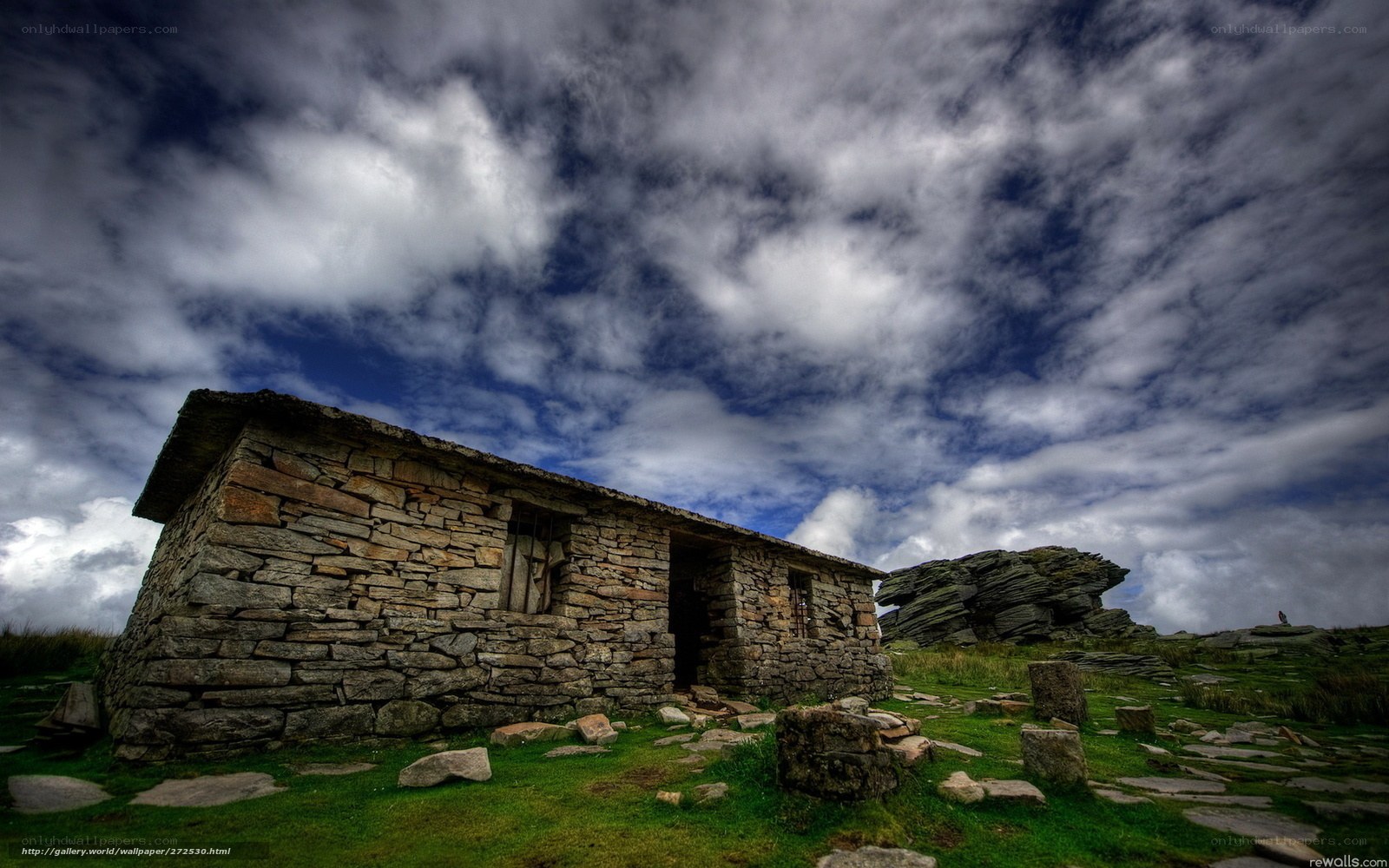 Stone hut on a rocky hill