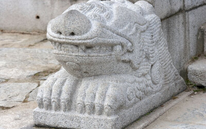 stone lion statue at temple