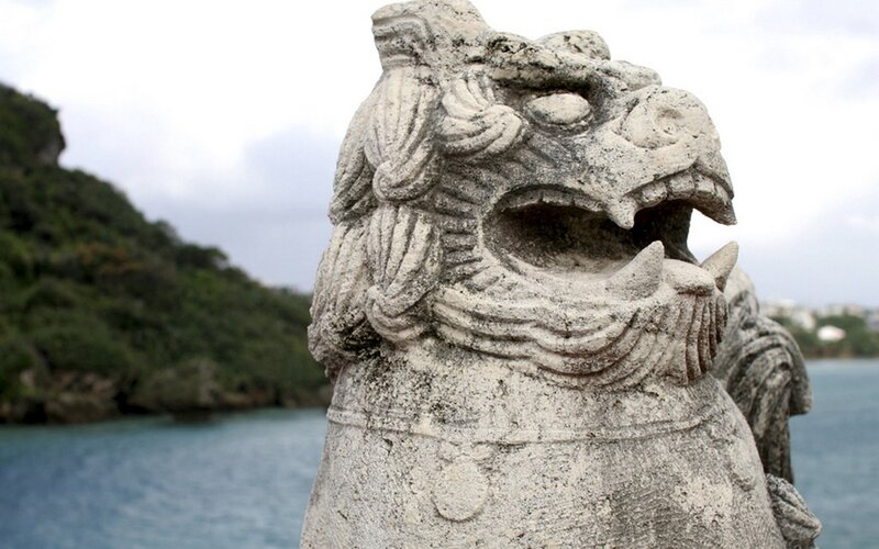 Stone lion statue by the sea