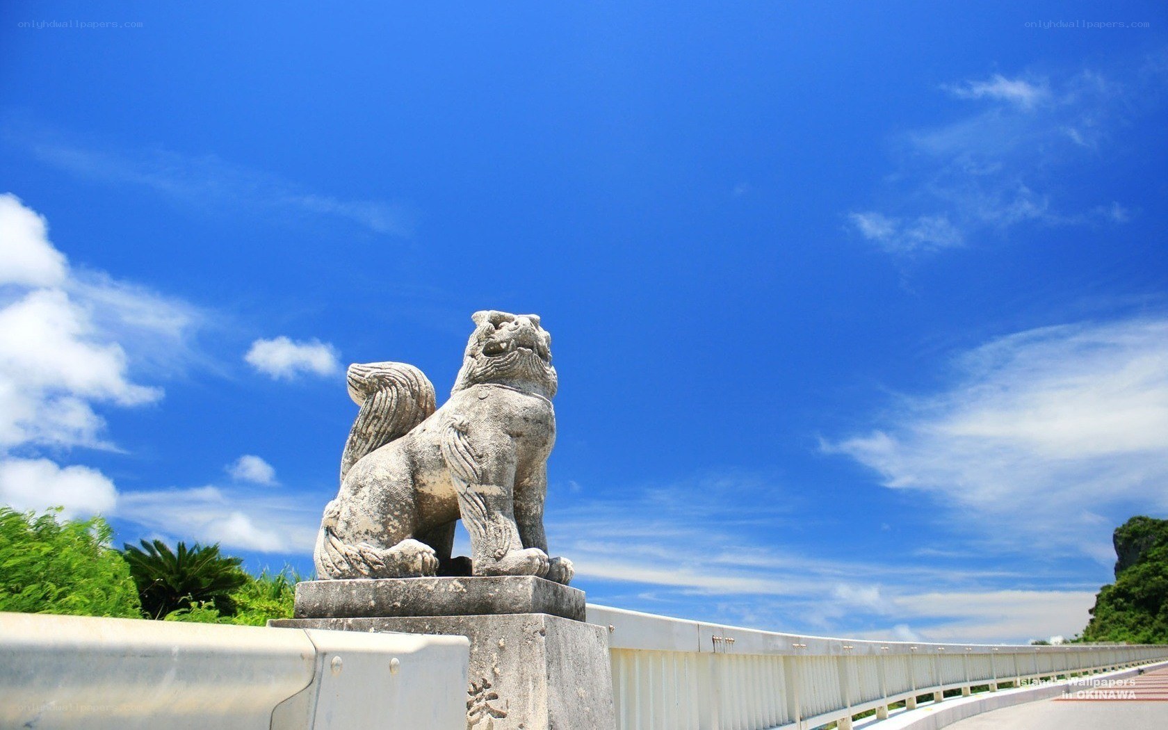 Stone lion statue on a bridge