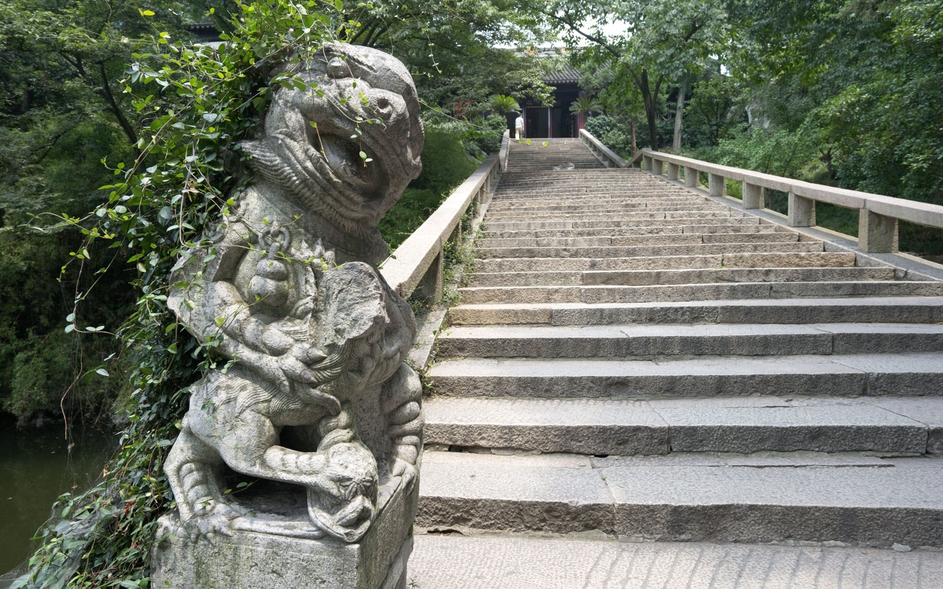 Stone lion statue on a bridge