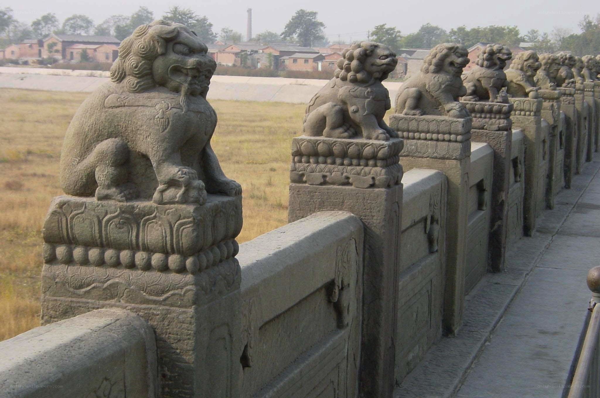 Stone lions on a bridge