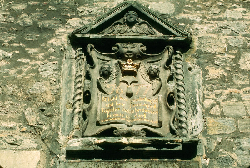 stone memorial plaque on wall