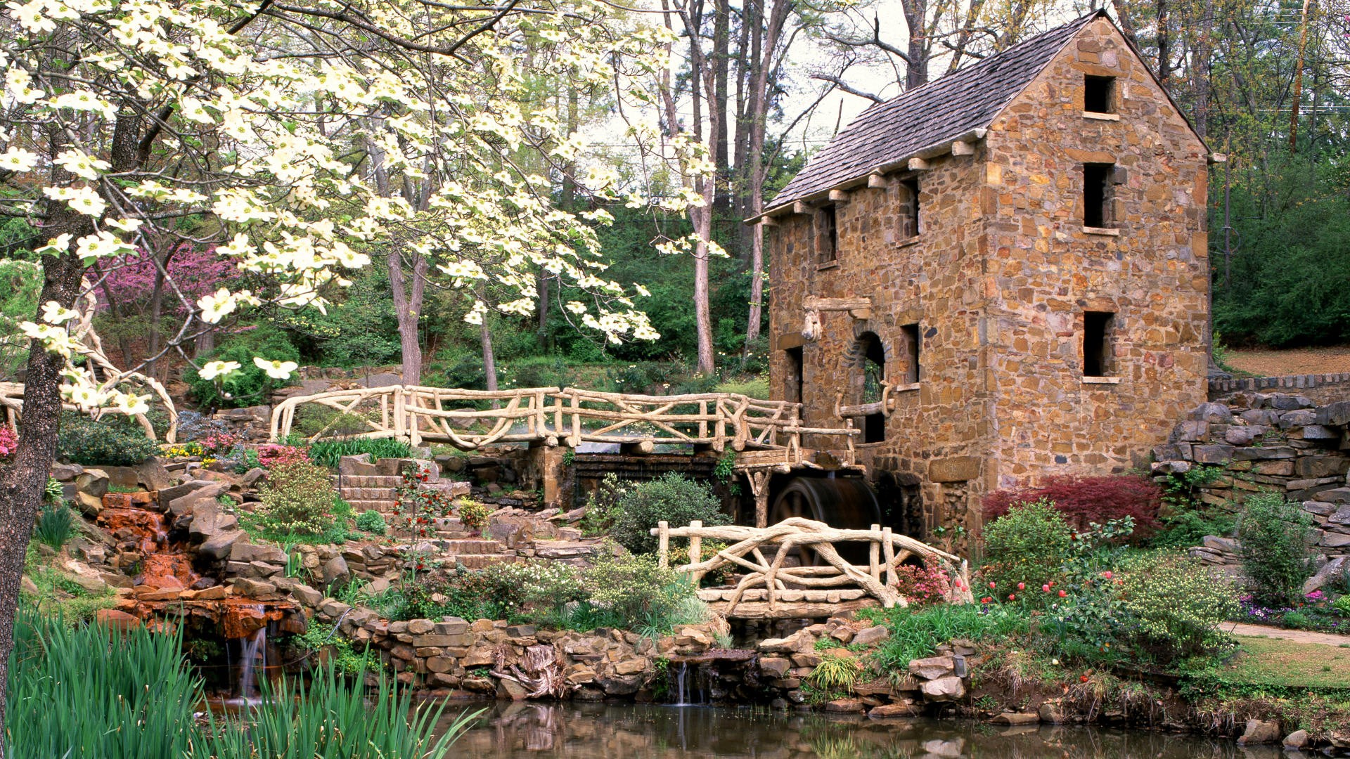 Stone mill by a garden stream