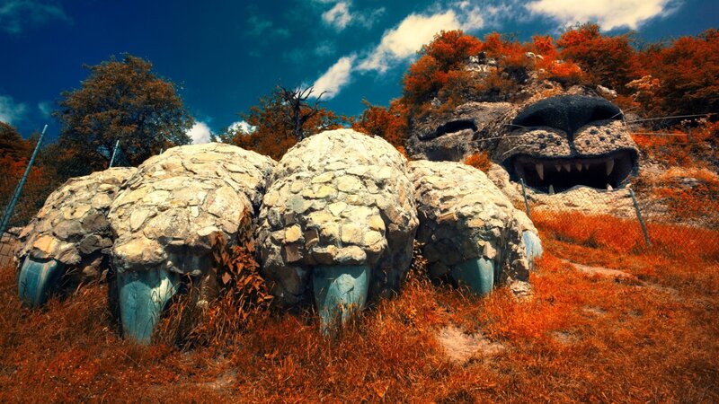 Stone monster sculpture in autumn