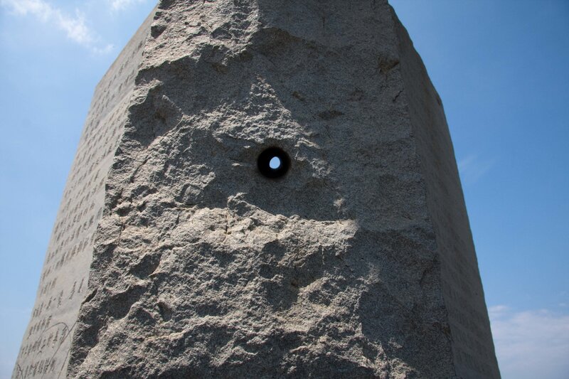 Stone monument with hole