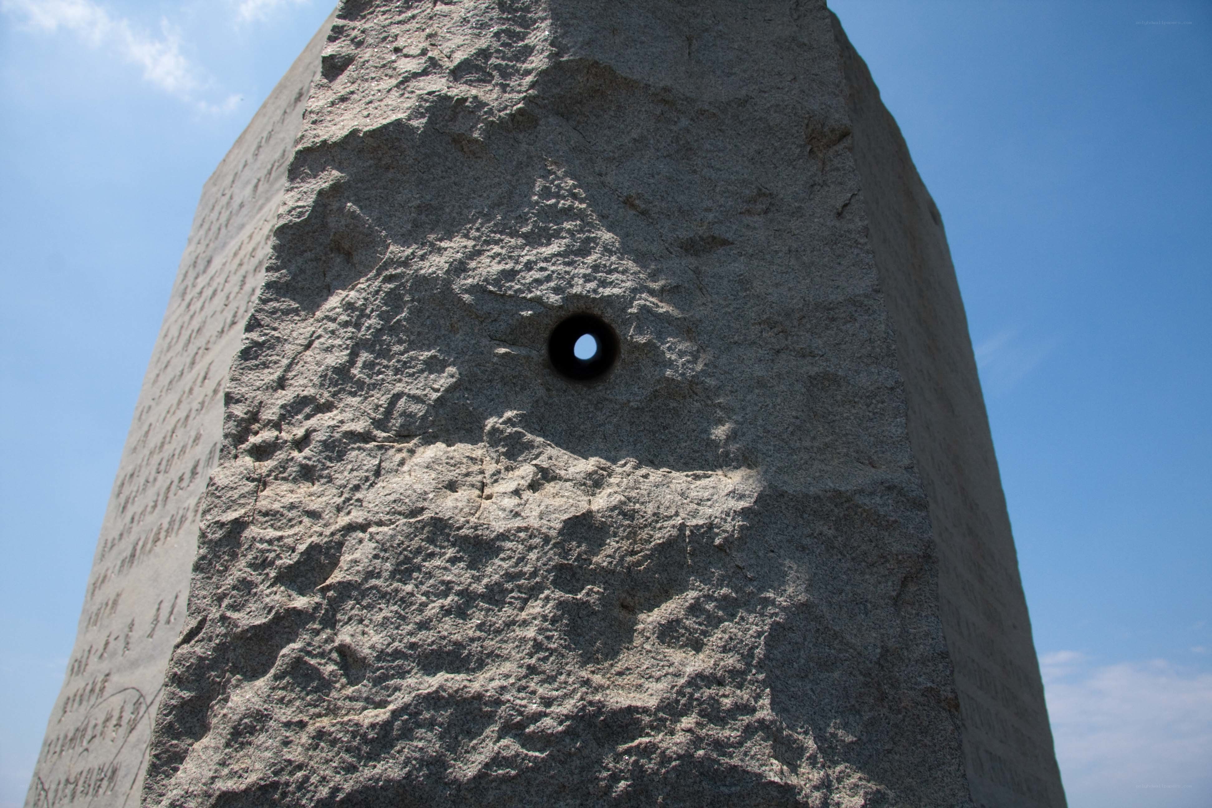 Stone monument with hole