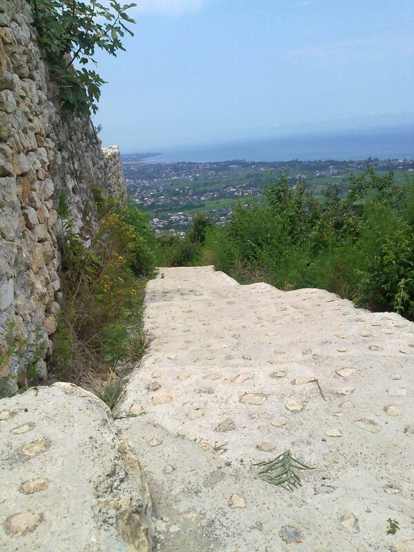 Stone path overlooking a coastal town