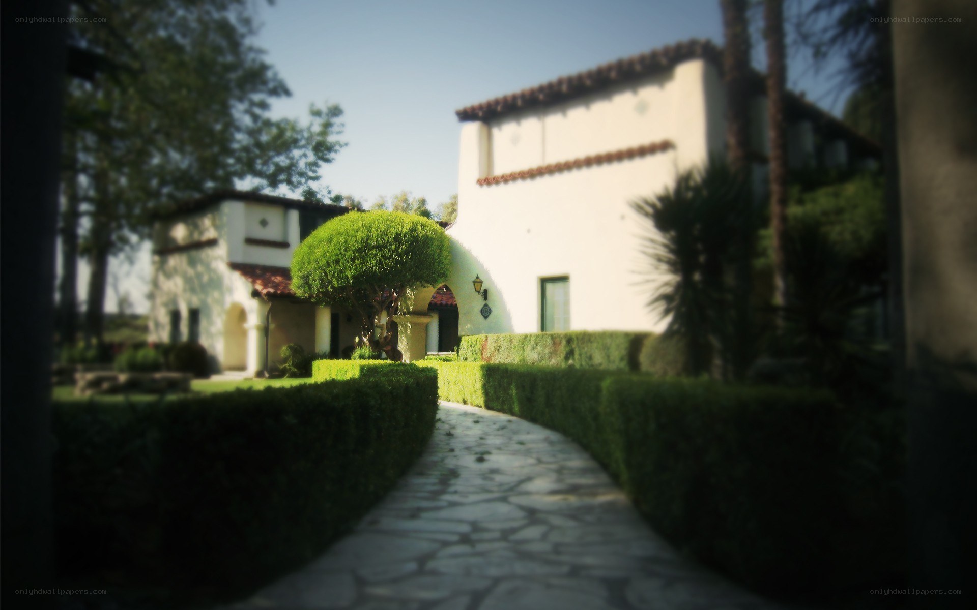 Stone path to a Spanish-style home