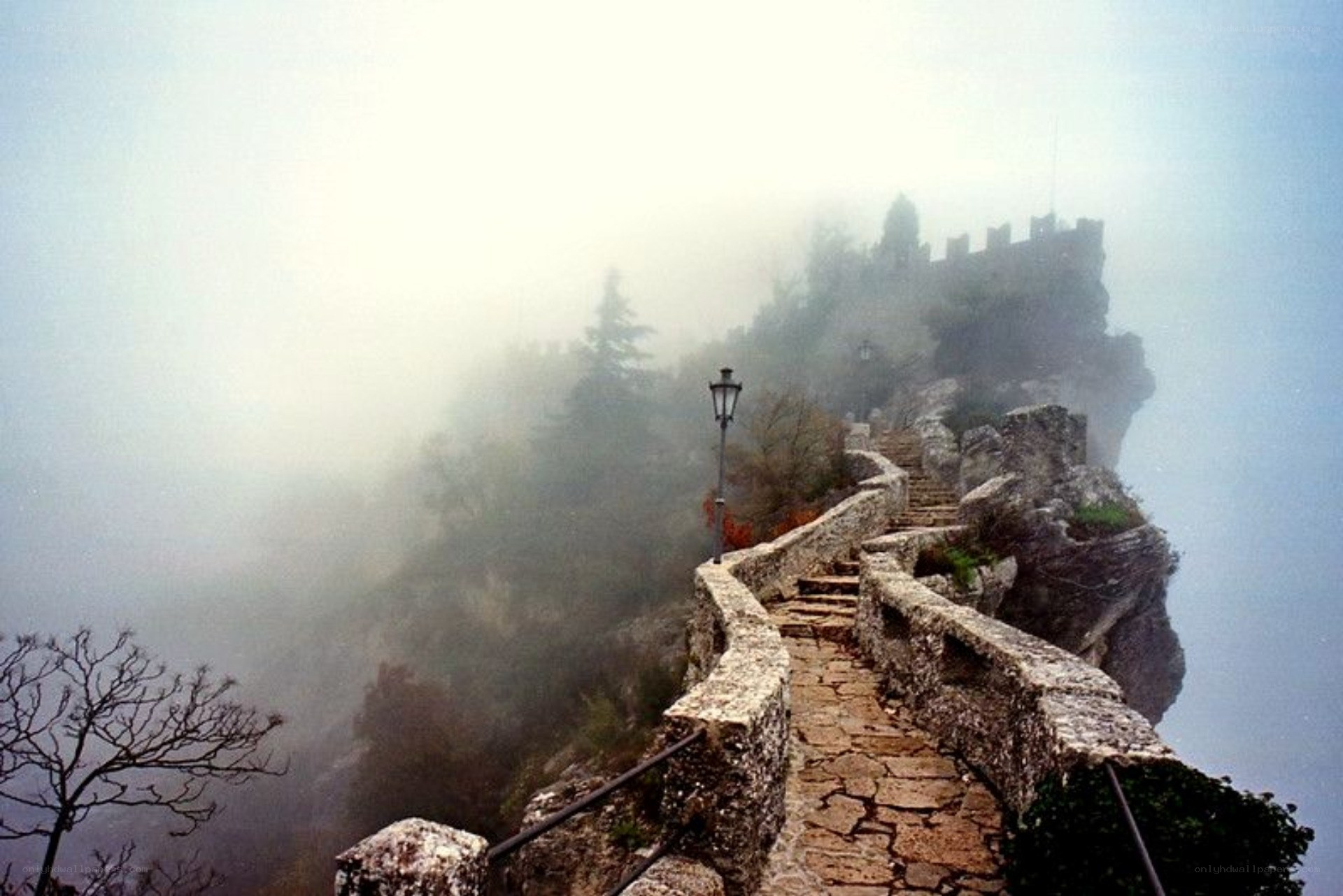 Stone path to castle in fog