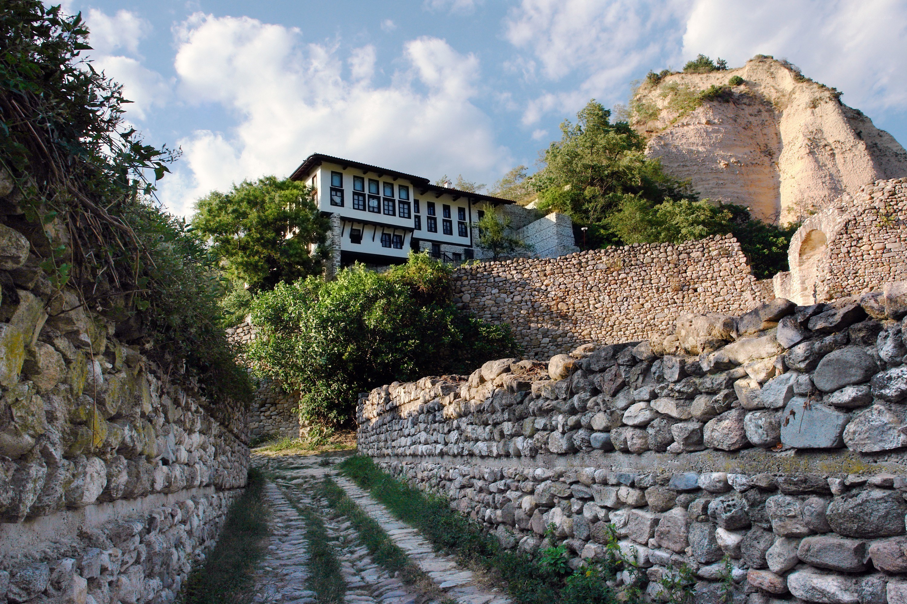 Stone path to traditional house