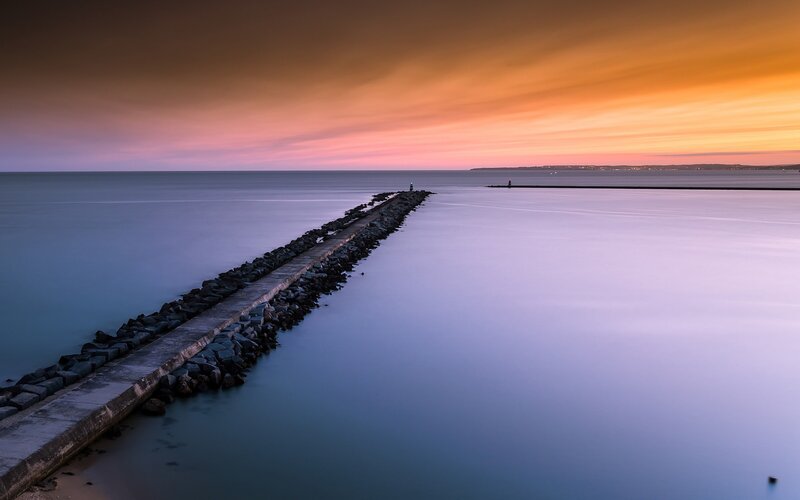 Stone Pier at Sunset — Orange, Serene, Photograph